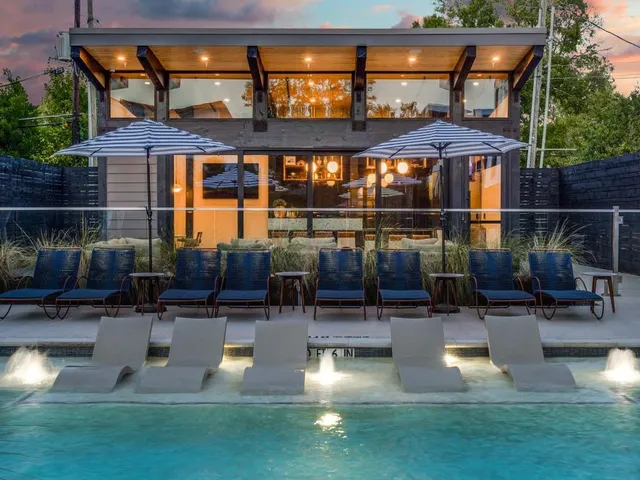 a view of a house with couches in a patio