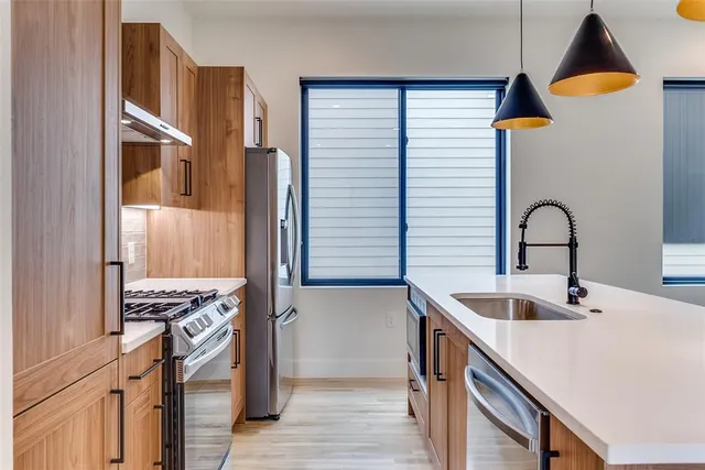 a kitchen with a sink and cabinets