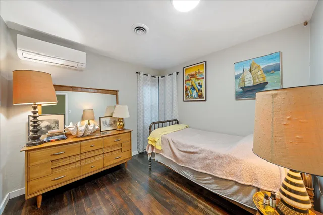 a bedroom with a bed and lamp