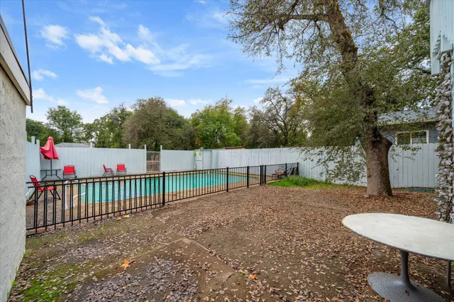 a view of a backyard with a small cabin