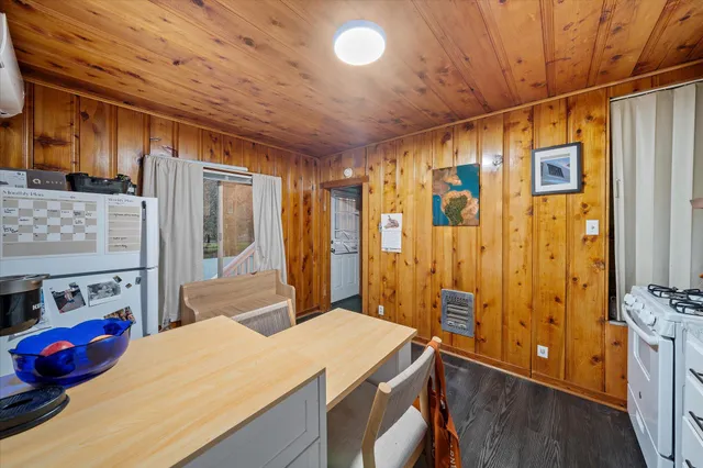 a bed room with a bed and a flat tv screen