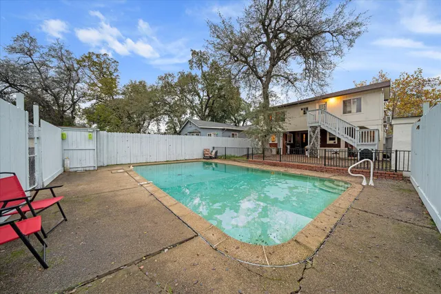 a view of a backyard with a patio
