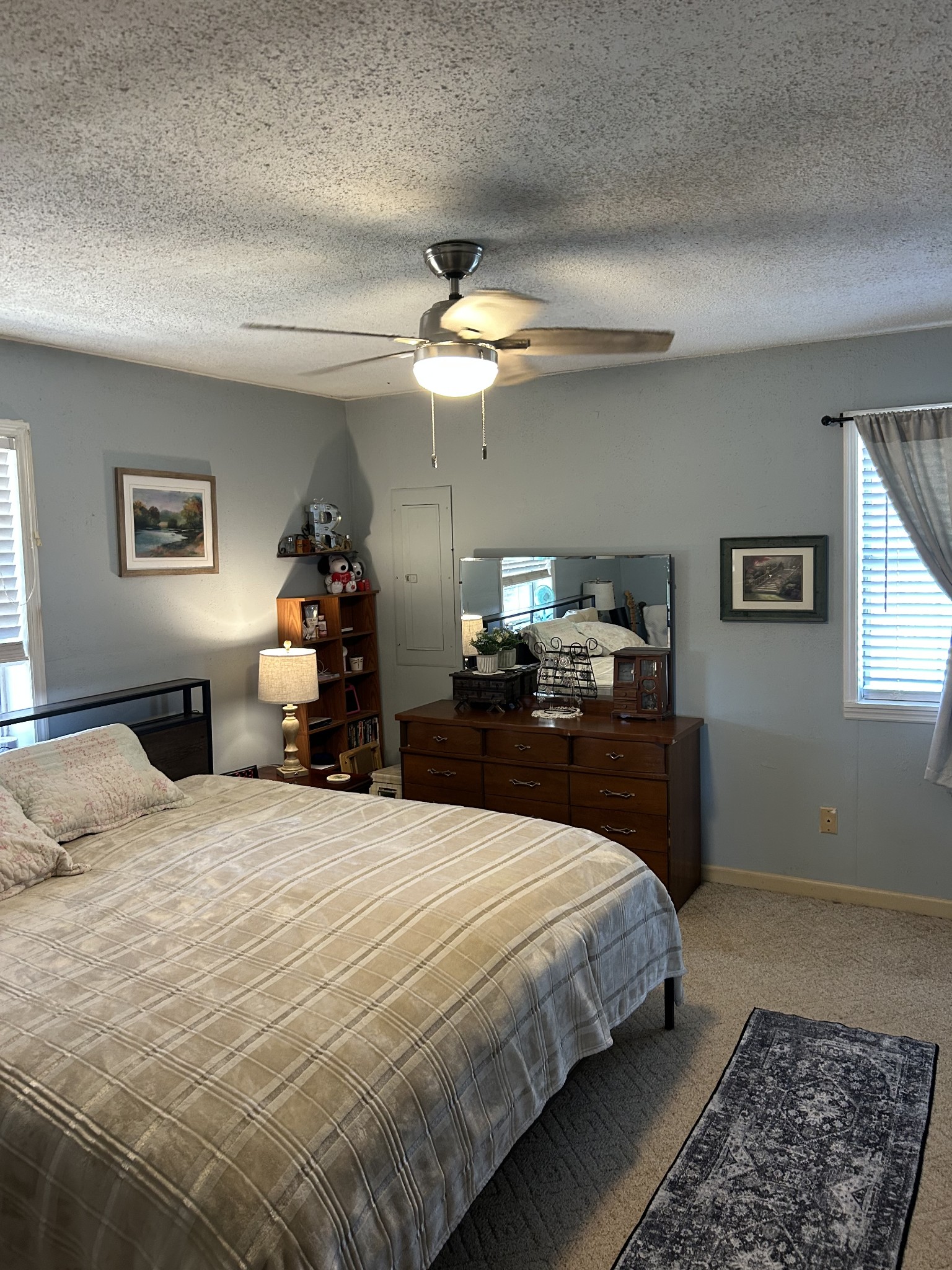 2023 Wayland Springs Road Iron City, TN 38463 - Photo 25 of 45 a bedroom with a bed and a chandelier