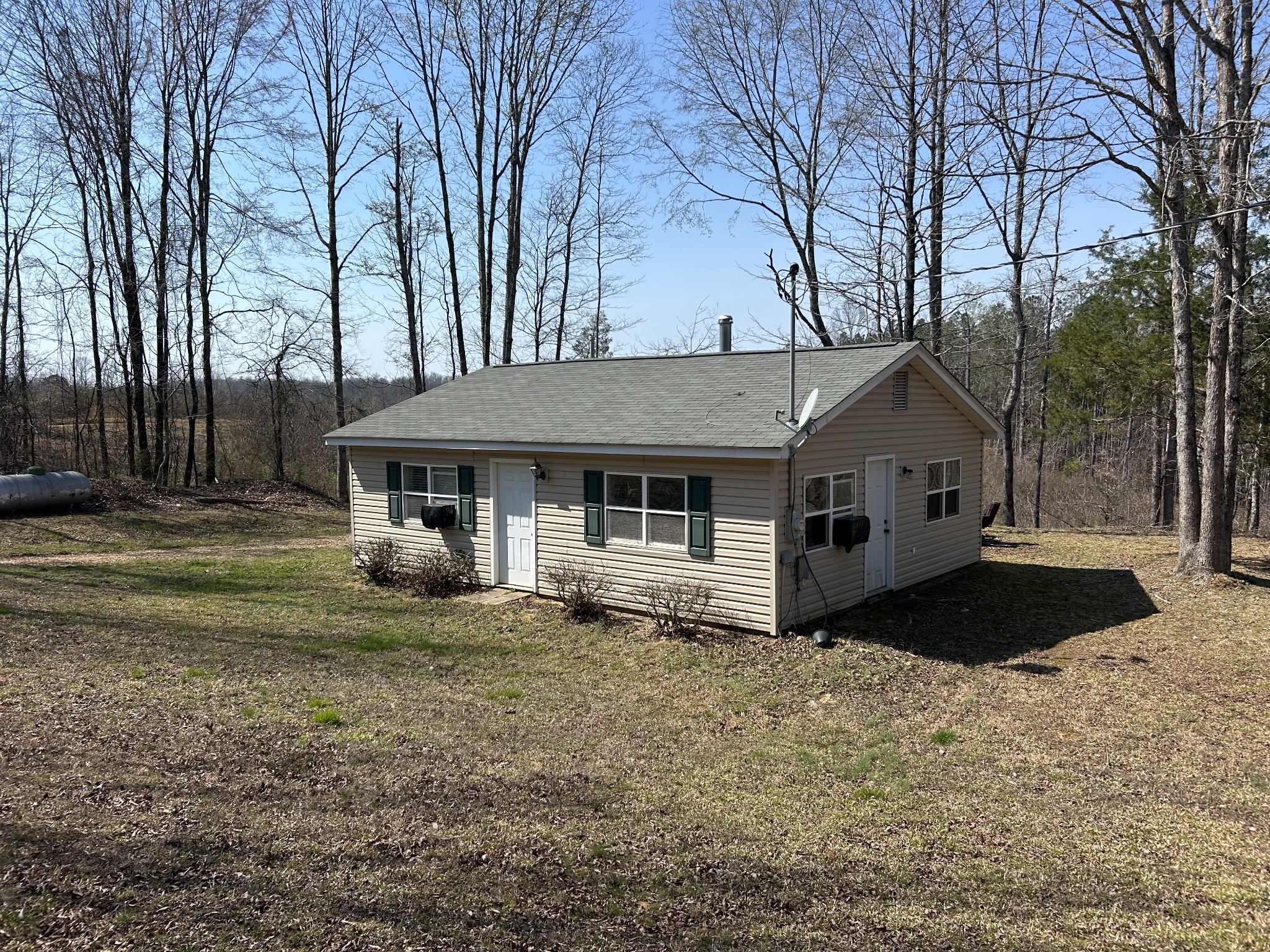 2023 Wayland Springs Road Iron City, TN 38463 - Photo 35 of 45 a front view of a house with a yard