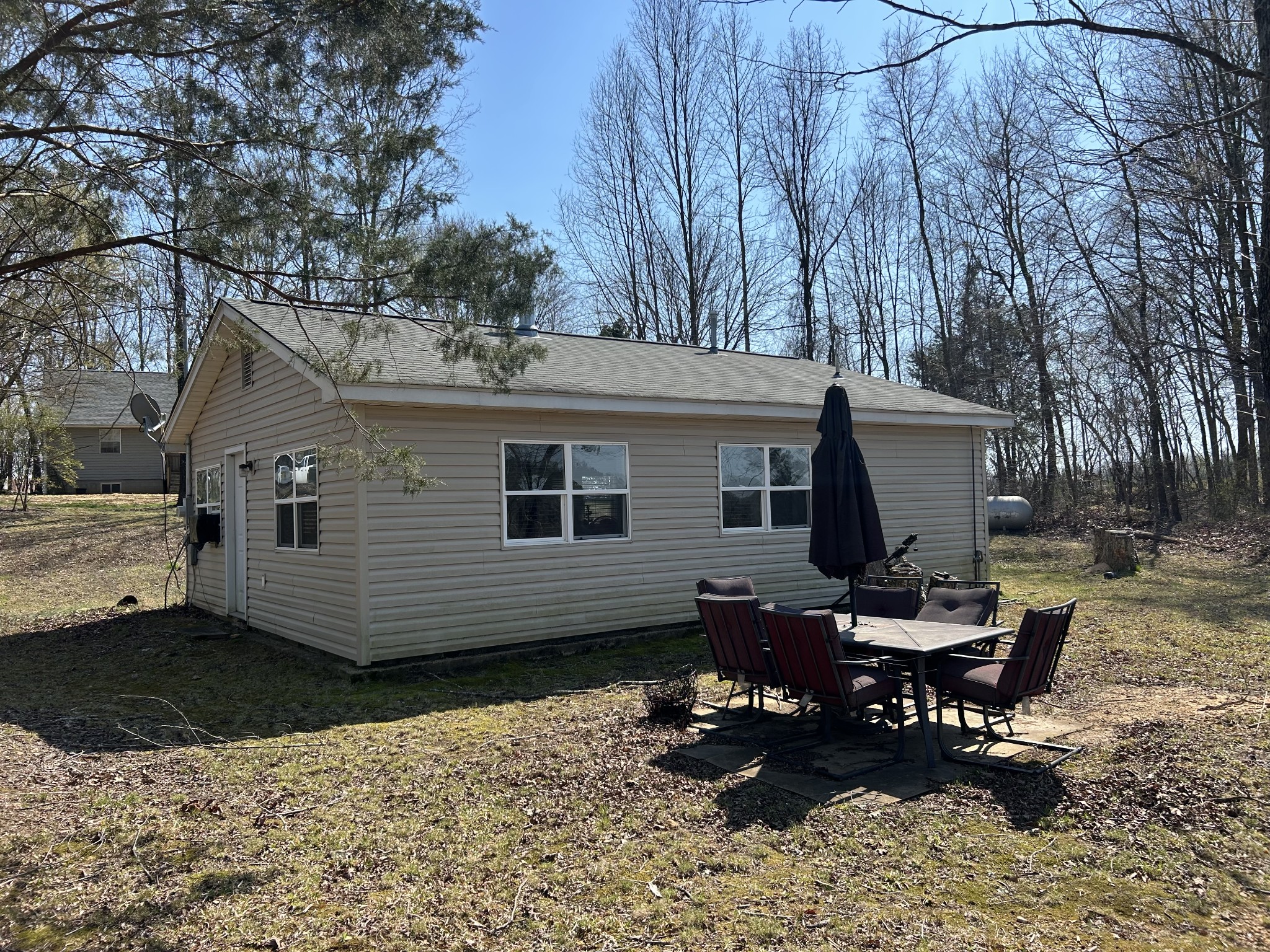 2023 Wayland Springs Road Iron City, TN 38463 - Photo 37 of 45 a view of a house with a yard chairs and a patio