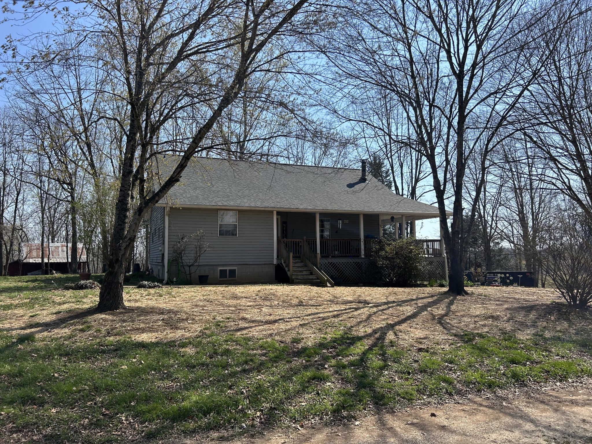 2023 Wayland Springs Road Iron City, TN 38463 - Photo 8 of 45 a front view of a house with a yard covered in snow