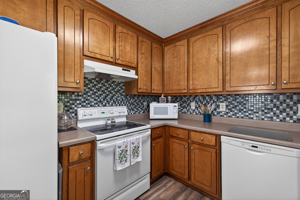 141 Pope Street Zebulon, GA 30295 - Photo 13 of 42 a kitchen with a sink stove and cabinets