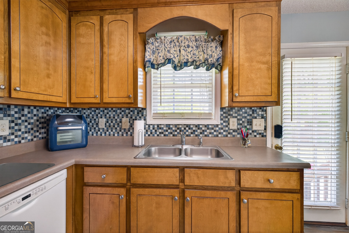 141 Pope Street Zebulon, GA 30295 - Photo 14 of 42 a kitchen with sink and window