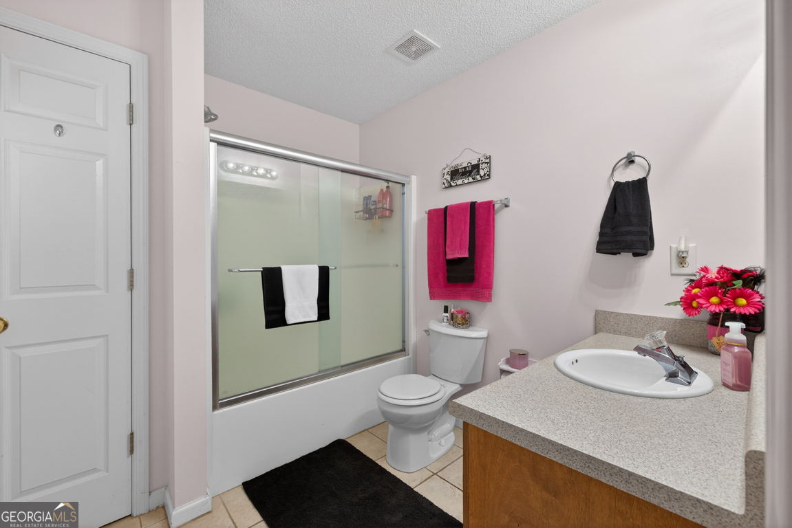 141 Pope Street Zebulon, GA 30295 - Photo 25 of 42 a bathroom with a sink toilet and a mirror