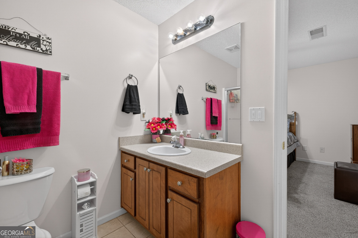 141 Pope Street Zebulon, GA 30295 - Photo 26 of 42 a bathroom with a sink vanity and mirror
