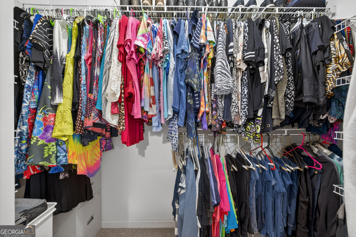 141 Pope Street Zebulon, GA 30295 - Photo 28 of 42 a view of walk in closet with clothes