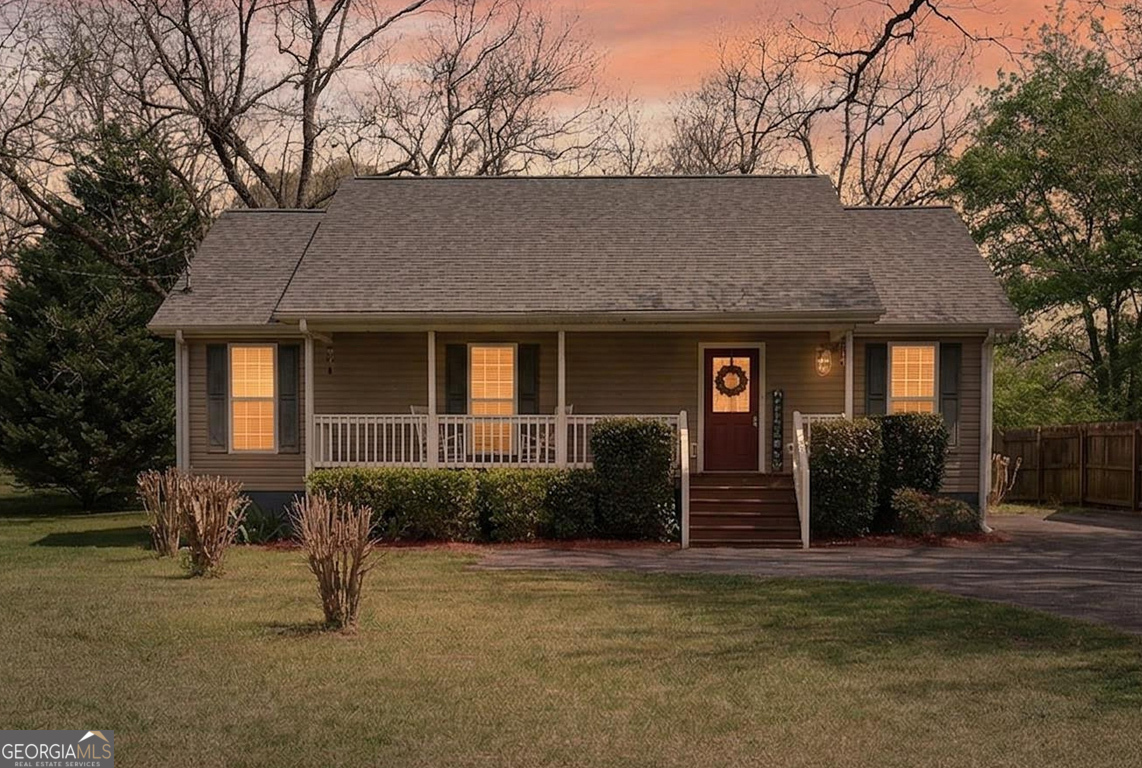 141 Pope Street Zebulon, GA 30295 - Photo 29 of 42 a front view of a house with a yard