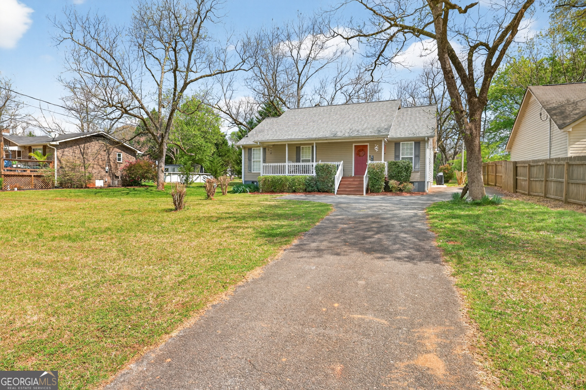 141 Pope Street Zebulon, GA 30295 - Photo 30 of 42 a front view of a house with a yard and trees