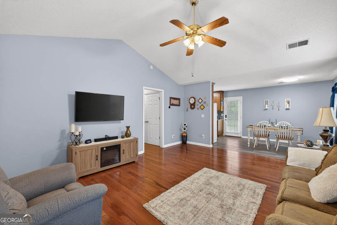 141 Pope Street Zebulon, GA 30295 - Photo 3 of 42 a living room with furniture and a flat screen tv