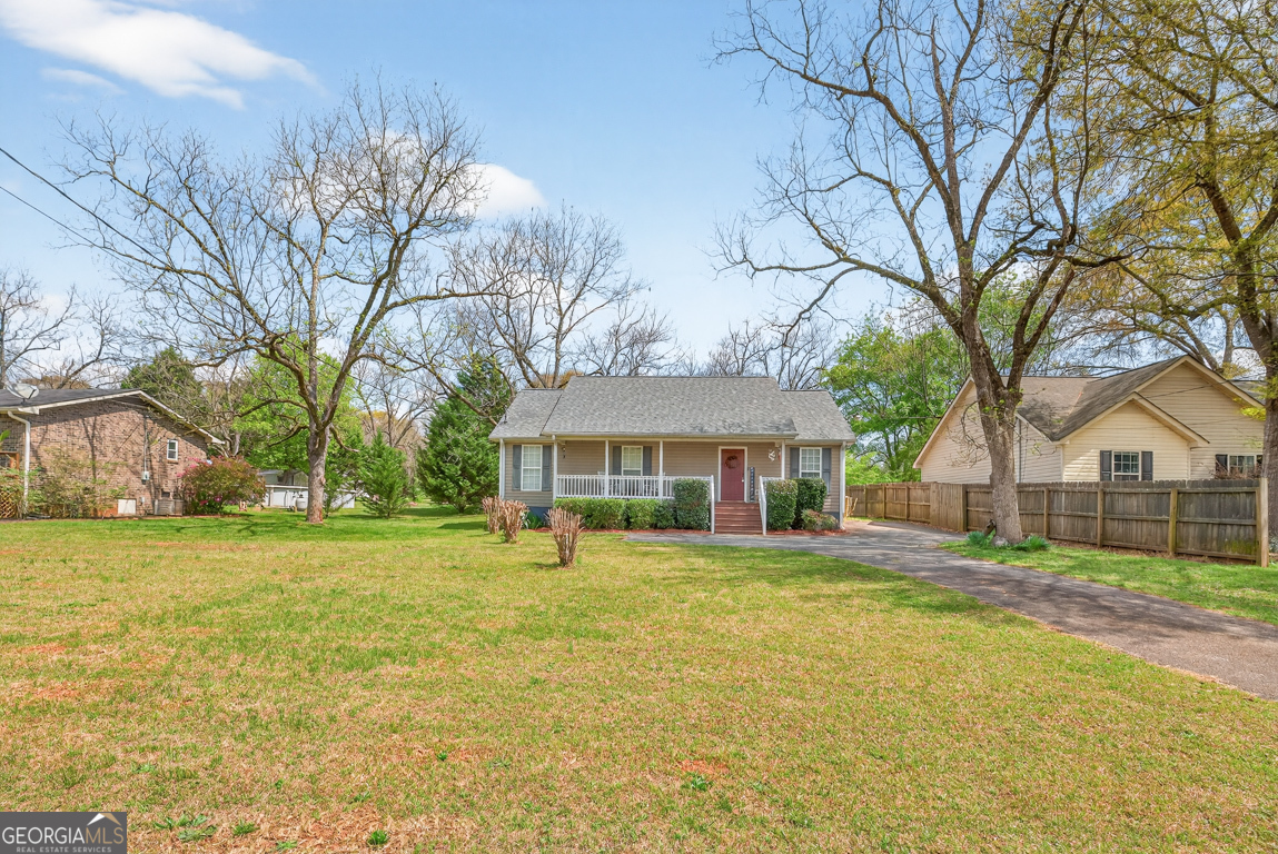 141 Pope Street Zebulon, GA 30295 - Photo 31 of 42 a view of a house with a yard and large trees