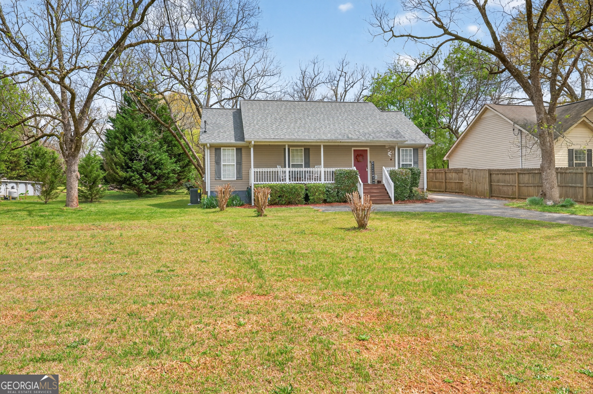 141 Pope Street Zebulon, GA 30295 - Photo 32 of 42 a front view of a house with a yard