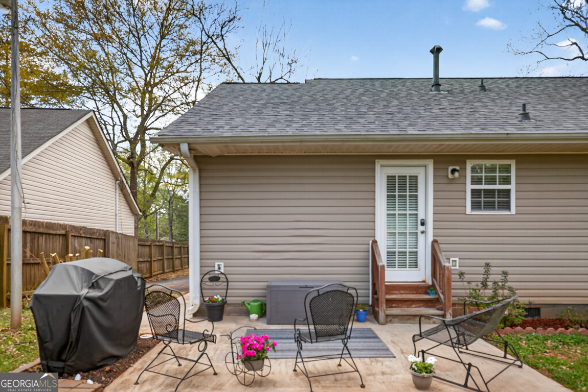 141 Pope Street Zebulon, GA 30295 - Photo 34 of 42 a view of outdoor kitchen and seating area