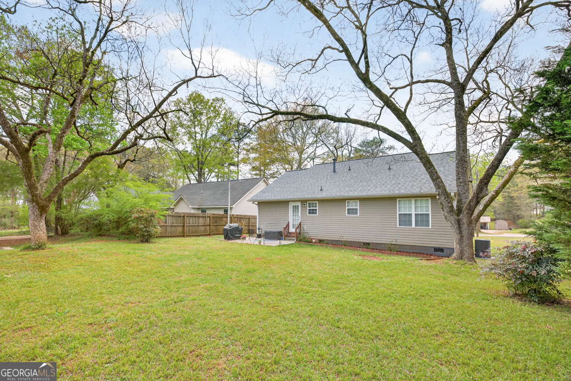 141 Pope Street Zebulon, GA 30295 - Photo 35 of 42 a house that has a tree in front of it