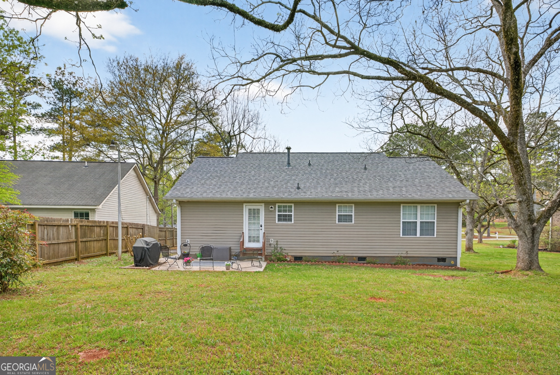 141 Pope Street Zebulon, GA 30295 - Photo 36 of 42 a front view of a house with a garden