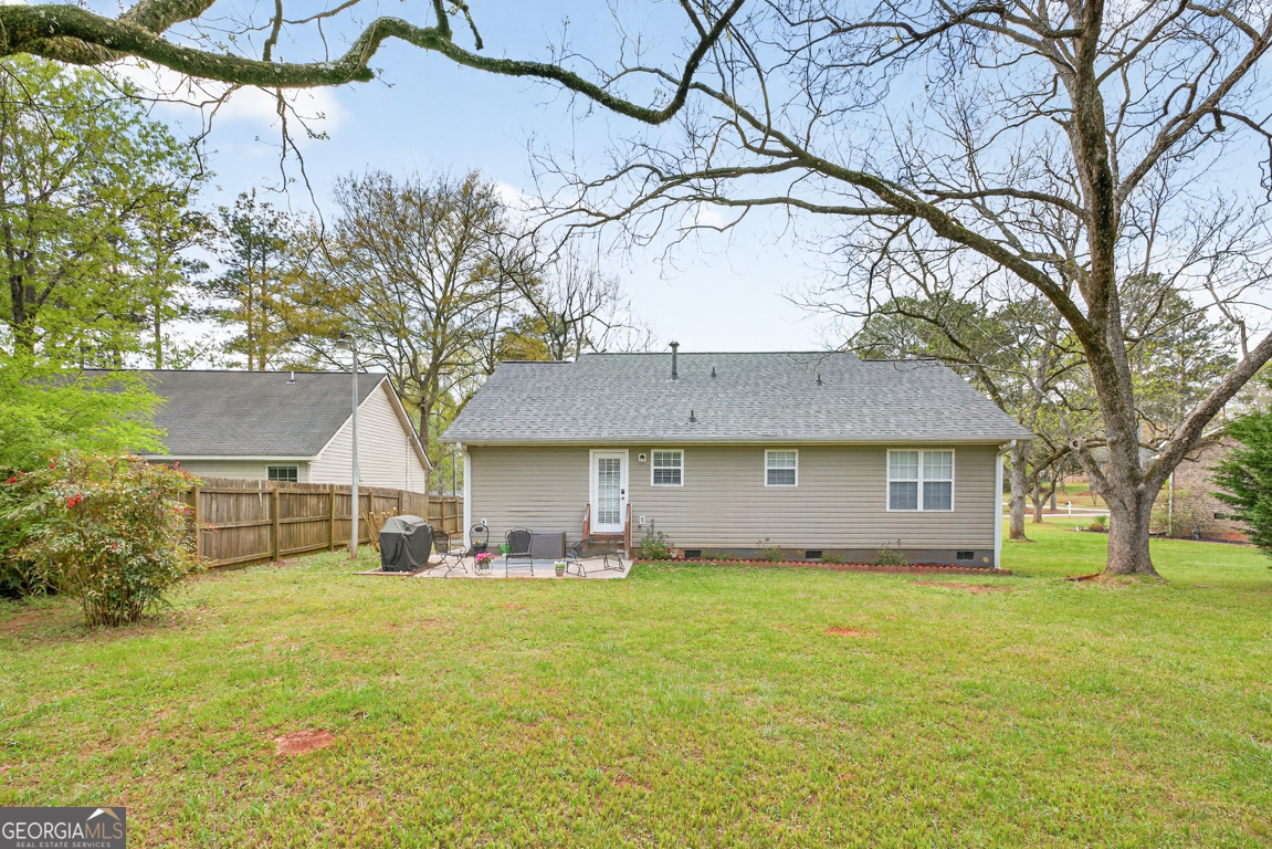 141 Pope Street Zebulon, GA 30295 - Photo 37 of 42 a front view of house with yard and trees