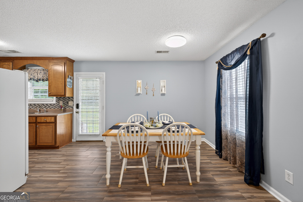 141 Pope Street Zebulon, GA 30295 - Photo 4 of 42 a view of a dining room with furniture and wooden floor