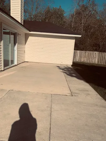 a view of backyard and tree
