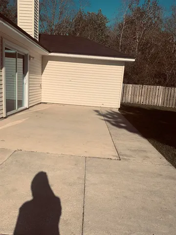 a view of backyard and tree