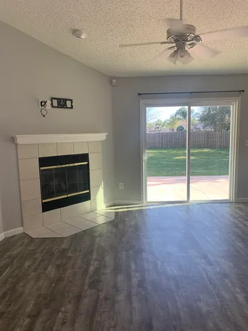 a view of an empty room with a fireplace