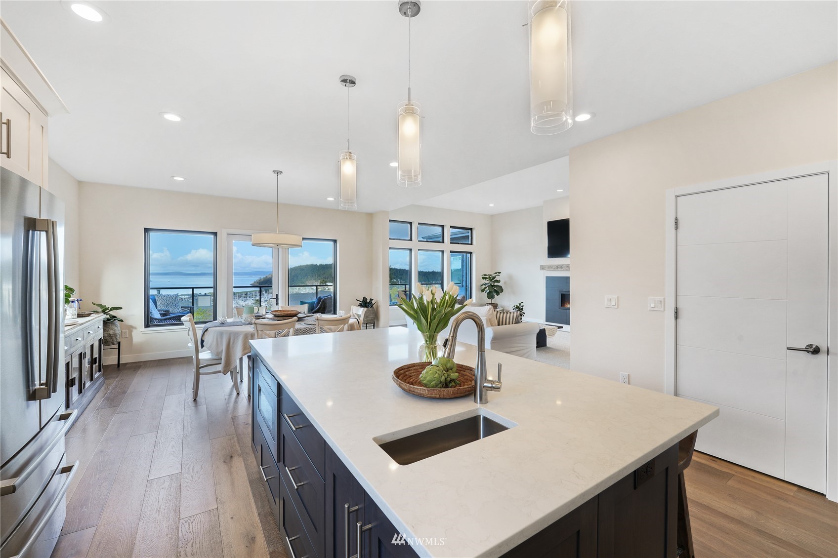 4920 Heather Drive Anacortes, WA 98221 - Photo 12 of 40 a kitchen with a table chairs and wooden floor