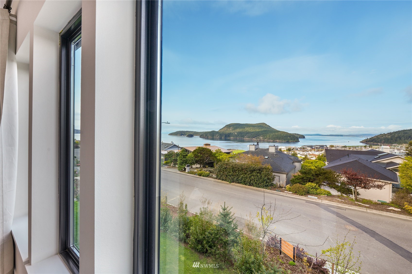 4920 Heather Drive Anacortes, WA 98221 - Photo 18 of 40 a view of a lake from a balcony