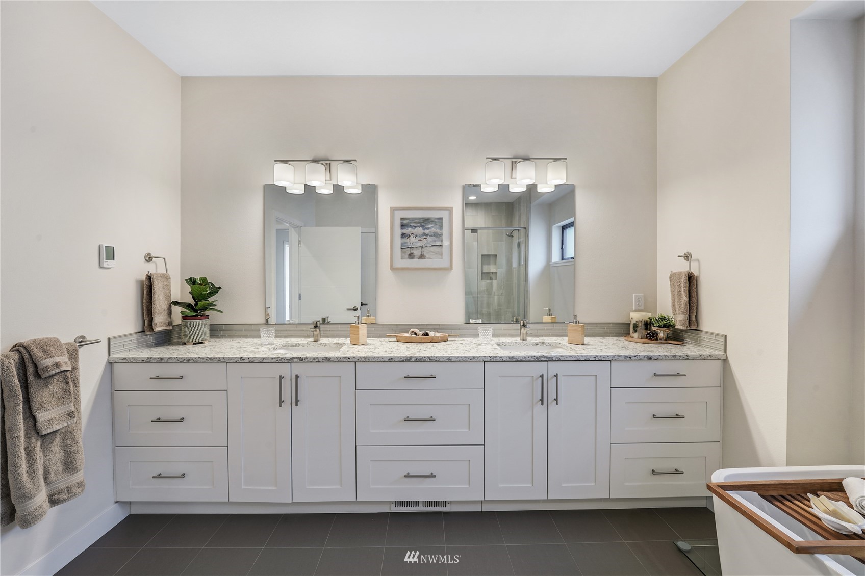 4920 Heather Drive Anacortes, WA 98221 - Photo 19 of 40 a bathroom with a granite countertop sink double and mirror