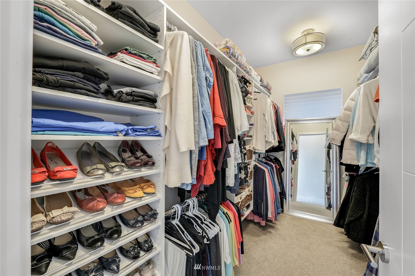 4920 Heather Drive Anacortes, WA 98221 - Photo 22 of 40 a view of walk in closet with clothes and shoes