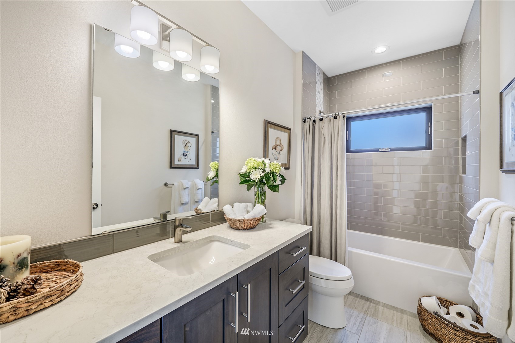 4920 Heather Drive Anacortes, WA 98221 - Photo 24 of 40 a bathroom with a granite countertop sink toilet and shower