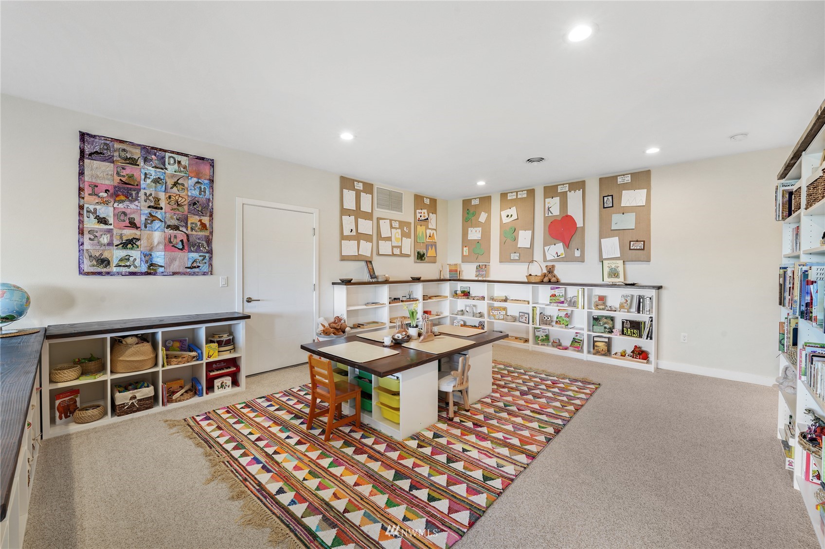 4920 Heather Drive Anacortes, WA 98221 - Photo 26 of 40 a living room with furniture a rug and a window
