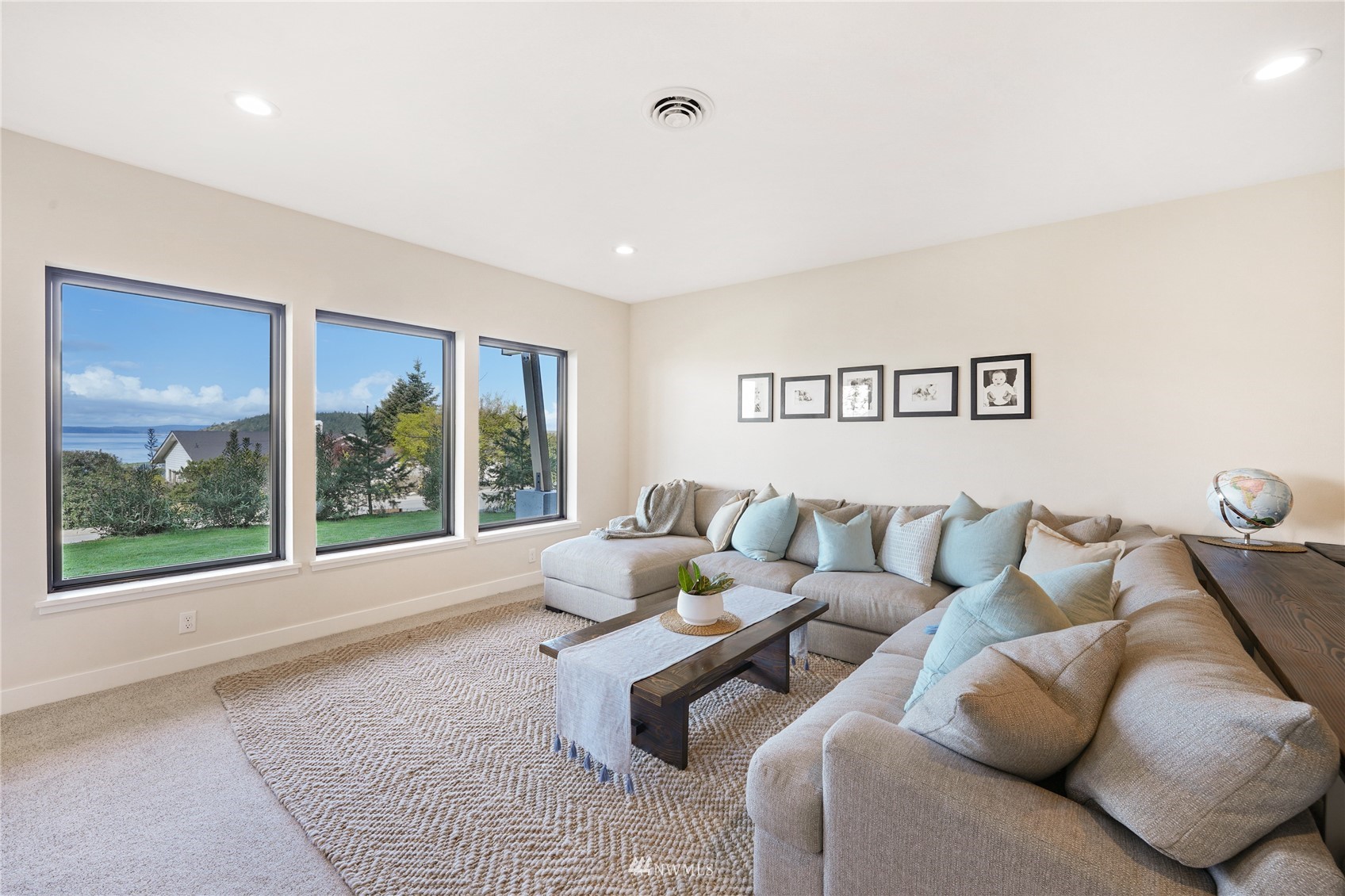 4920 Heather Drive Anacortes, WA 98221 - Photo 28 of 40 a living room with furniture and a large window