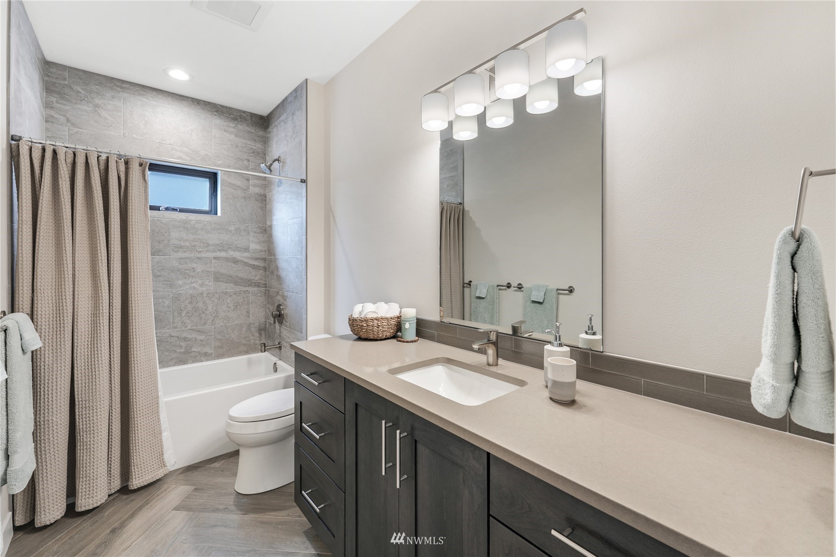 4920 Heather Drive Anacortes, WA 98221 - Photo 31 of 40 a bathroom with a granite countertop sink and a mirror