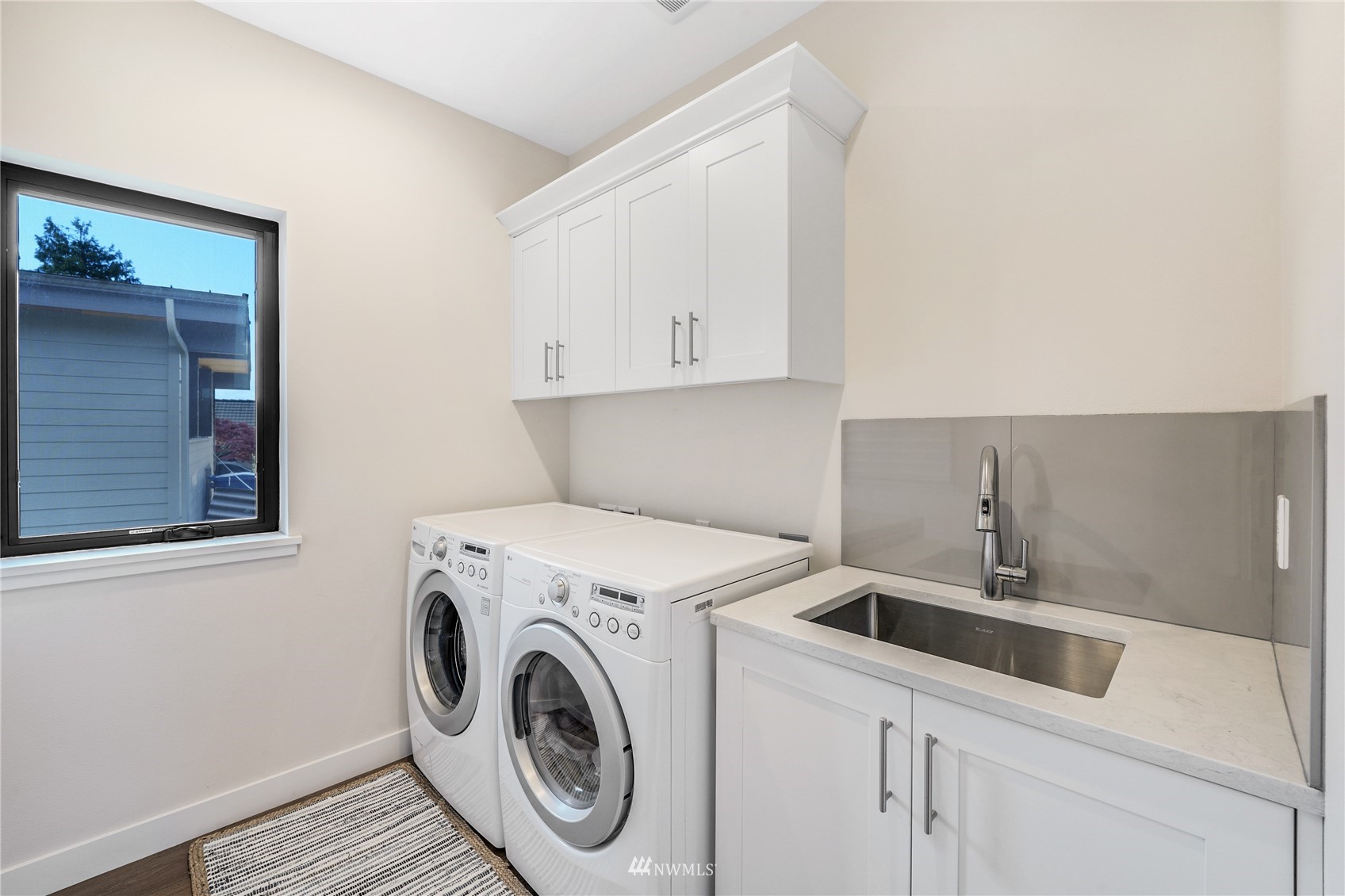 4920 Heather Drive Anacortes, WA 98221 - Photo 33 of 40 a utility room with dryer and washer