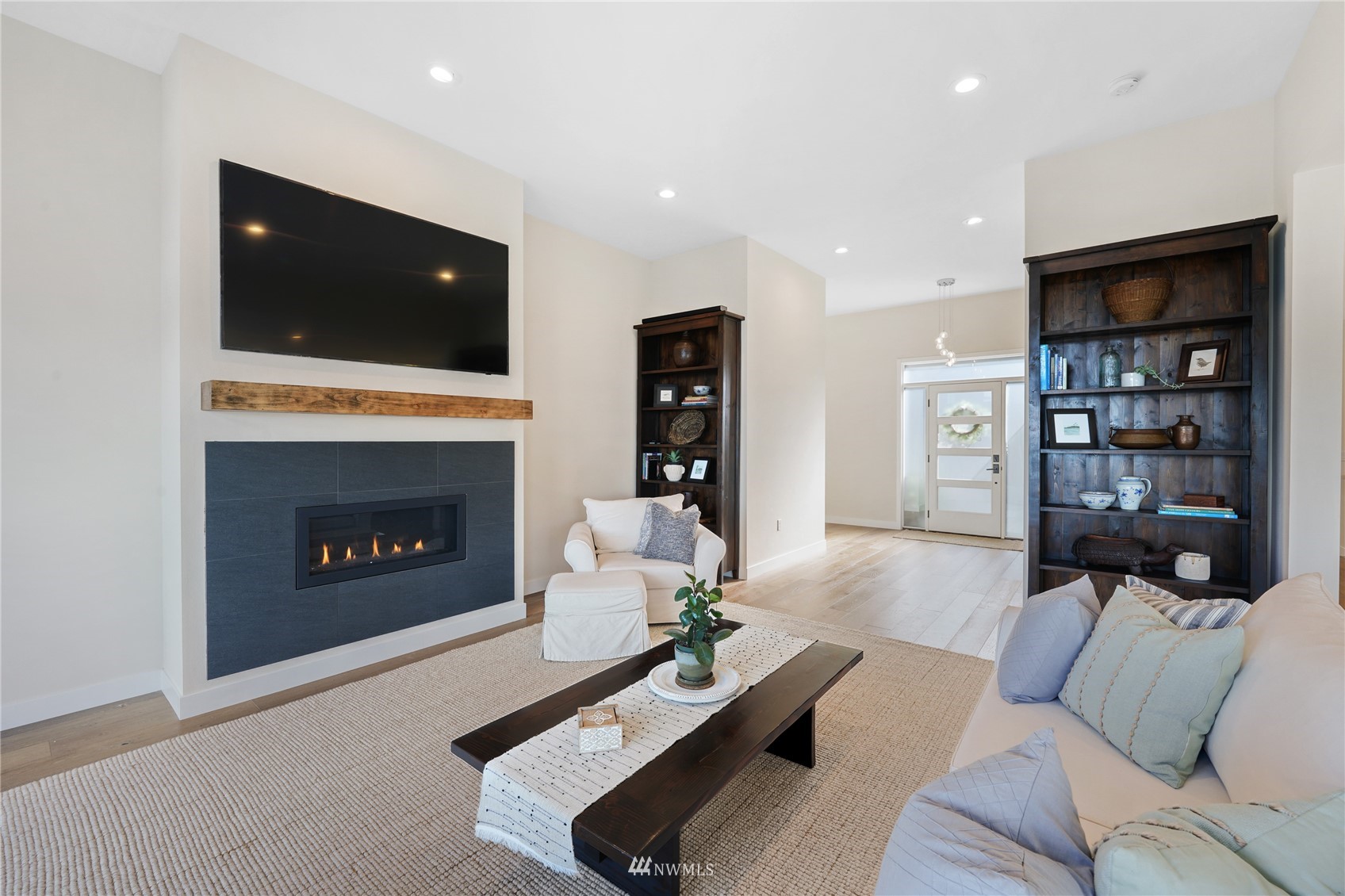 4920 Heather Drive Anacortes, WA 98221 - Photo 6 of 40 a living room with furniture and a fireplace
