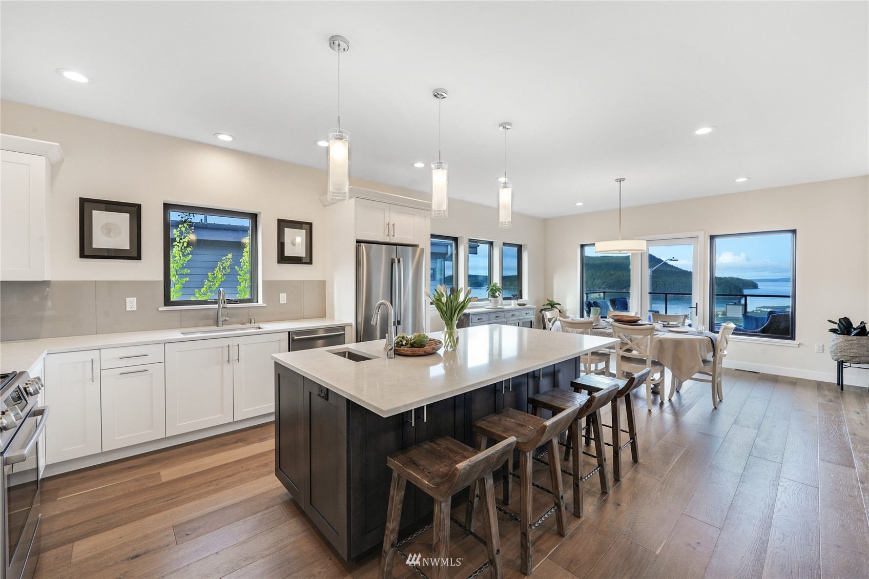 4920 Heather Drive Anacortes, WA 98221 - Photo 9 of 40 a large kitchen with a table and chairs
