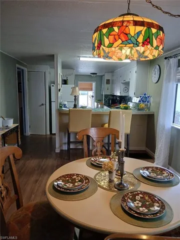a kitchen with stainless steel appliances granite countertop a refrigerator and a stove