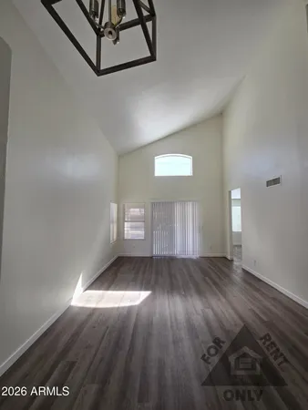 a view of an empty room and window