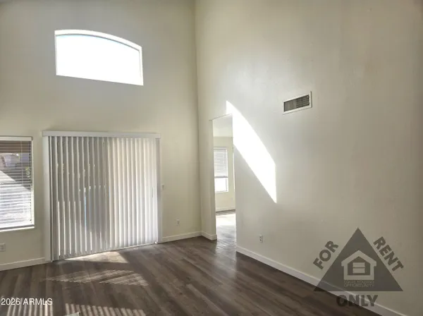 a view of a livingroom with wooden floor