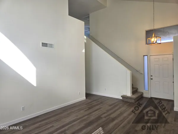 a view of a livingroom with wooden floor