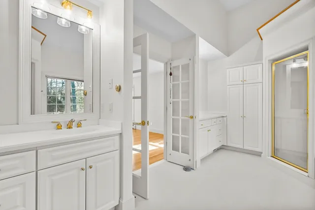 a view of a room that has a bed and a window