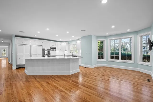 a view of kitchen with cabinets and wooden floor