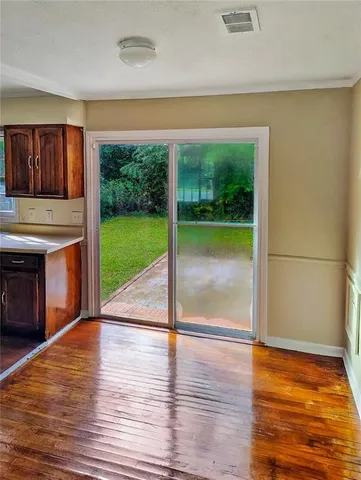 a view of a room with a large window