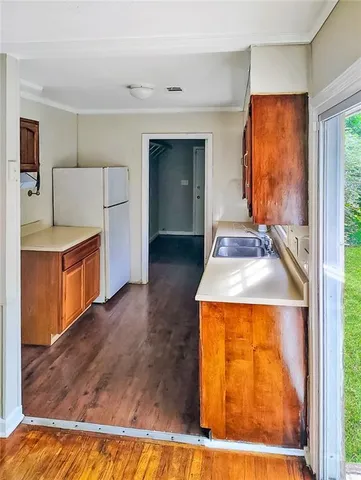 a kitchen with a stove and a refrigerator