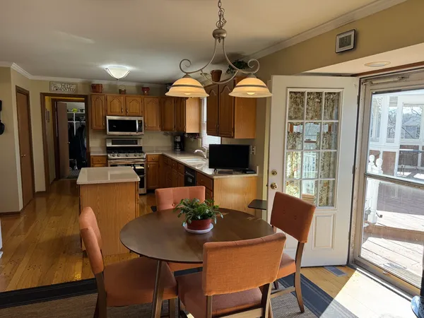 a view of a dining room with furniture window and wooden floor