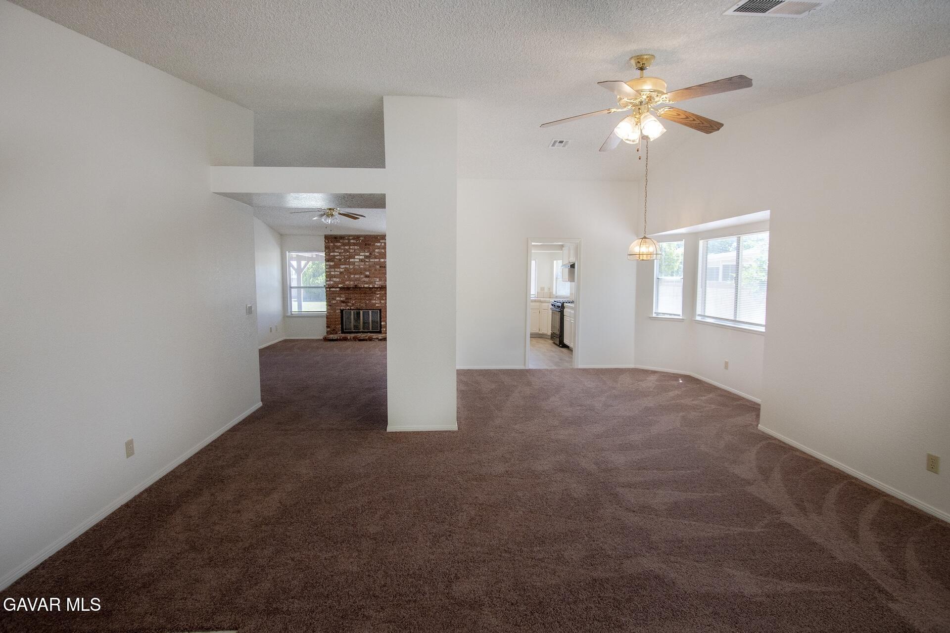 44318 33rd Street West Lancaster, CA 93536 - Photo 16 of 29 an empty room with windows and fan
