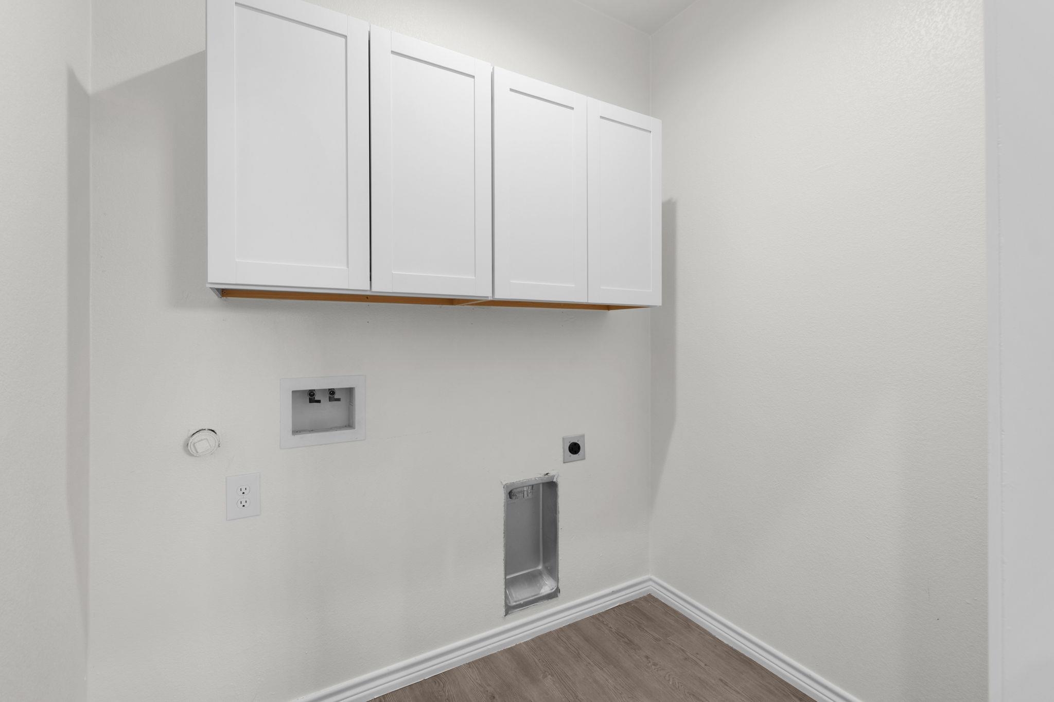 870 Waco Street Kingsland, TX 78639 - Photo 17 of 30 a view of storage and utility room with wooden floor